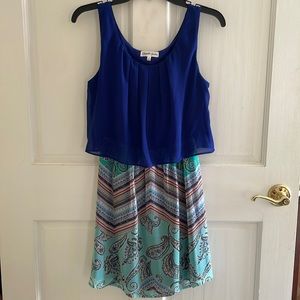 Cute open back dress with Sheer flowy attached top.